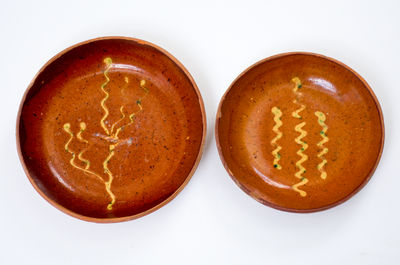 Two Slip-Decorated Berks County, Pennsylvania Redware Plates