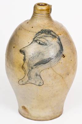 Fine and Rare Stoneware Jug with Incised Man's Head Decoration