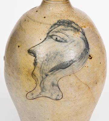 Fine and Rare Stoneware Jug with Incised Man s Head Decoration