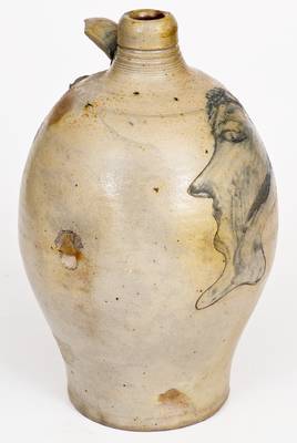 Fine and Rare Stoneware Jug with Incised Man s Head Decoration