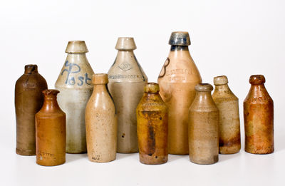 Ten Stoneware Bottles, primarily American, 19th century