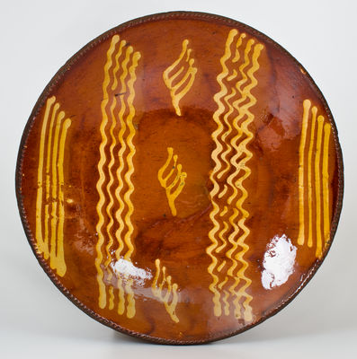 Exceptional Large-Sized Philadelphia Redware Charger w/ Elaborate Yellow Slip Decoration, early 19th century