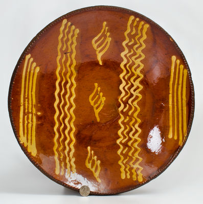 Exceptional Large-Sized Philadelphia Redware Charger w/ Elaborate Yellow Slip Decoration, early 19th century