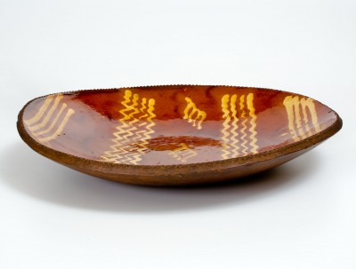 Exceptional Large-Sized Philadelphia Redware Charger w/ Elaborate Yellow Slip Decoration, early 19th century