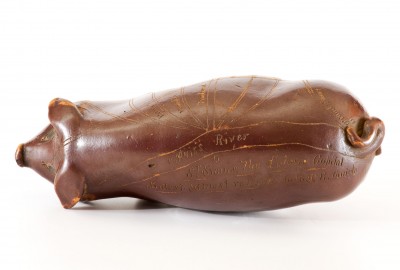 Fine Albany-Glazed Anna Pottery "Railroad & River Guide" Pig Bottle