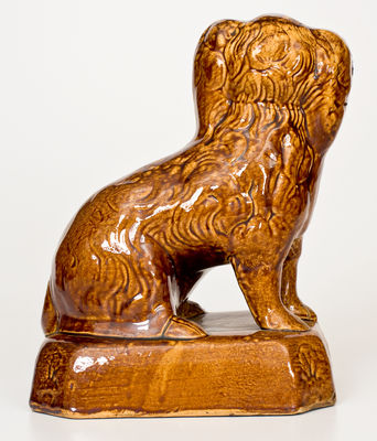 Rockingham-Glazed Ohio Figure of a Spaniel, second half 19th century.