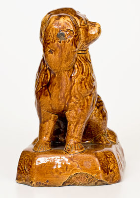 Rockingham-Glazed Ohio Figure of a Spaniel, second half 19th century.