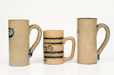 Three Cobalt-Decorated American Stoneware Mugs