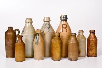 Ten Stoneware Bottles, primarily American, 19th century