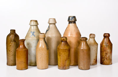 Ten Stoneware Bottles, primarily American, 19th century