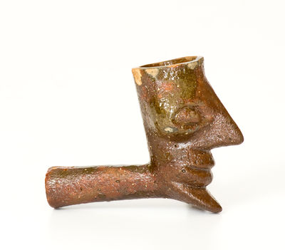 Rare Large-Sized Redware Face Pipe, possibly Southern origin, 19th century