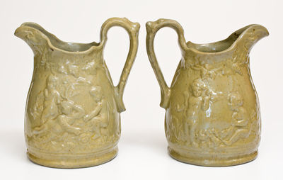 Extremely Rare Pair of JOHN BELL / WAYNESBORO Redware Pitchers with Molded Cherub Design