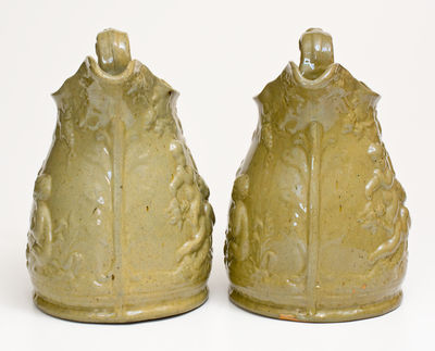 Extremely Rare Pair of JOHN BELL / WAYNESBORO Redware Pitchers with Molded Cherub Design