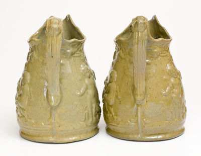 Extremely Rare Pair of JOHN BELL / WAYNESBORO Redware Pitchers with Molded Cherub Design