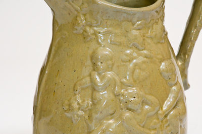 Extremely Rare Pair of JOHN BELL / WAYNESBORO Redware Pitchers with Molded Cherub Design