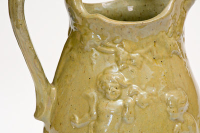 Extremely Rare Pair of JOHN BELL / WAYNESBORO Redware Pitchers with Molded Cherub Design