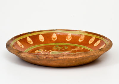 Exceptional Southeastern Pennsylvania Redware Dish with Two-Color Slip Bird Decoration, 1807