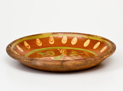 Exceptional Southeastern Pennsylvania Redware Dish with Two-Color Slip Bird Decoration, 1807