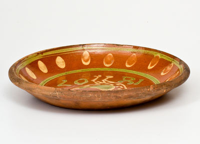 Exceptional Southeastern Pennsylvania Redware Dish with Two-Color Slip Bird Decoration, 1807