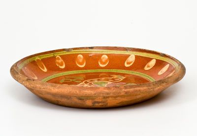 Exceptional Southeastern Pennsylvania Redware Dish with Two-Color Slip Bird Decoration, 1807