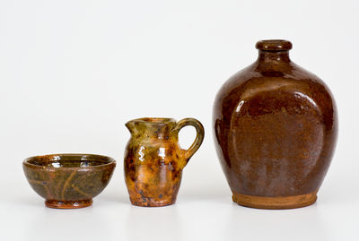 Three Small Glazed American Redware Articles, 19th and 20th centuries