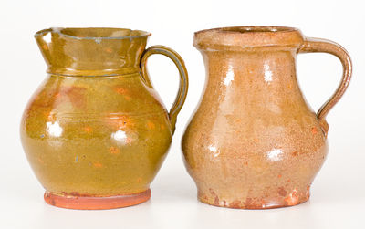 Two Glazed New York State Redware Pitchers, second or third quarter 19th century.