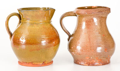 Two Glazed New York State Redware Pitchers, second or third quarter 19th century.