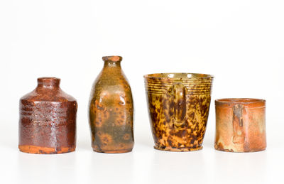 Four Small Glazed American Redware Articles, 19th century