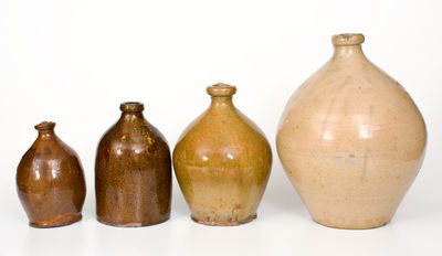 Four Glazed Northeastern U.S. Redware Jugs