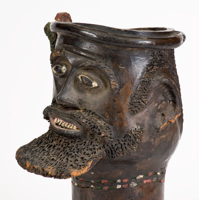 Rare Cold-Painted Stoneware Face Urn, late 19th or 20th century