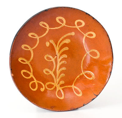 Fine Norwalk, CT Redware Plate with Loop and Foliate Yellow Slip Design