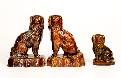 Three Rockingham-Glazed Spaniel Figures, second half 19th century