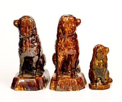 Three Rockingham-Glazed Spaniel Figures, second half 19th century