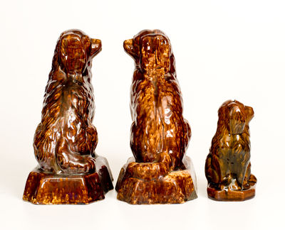 Three Rockingham-Glazed Spaniel Figures, second half 19th century