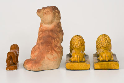 Lot of Four: Stoneware Animal Figures incl. Ohio Spaniel, Lion Figure, and Pair of Lions