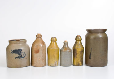 Lot of Six: Stoneware Vessels incl. Four Bottles, J. SWANK & CO. Jar, Unmarked Van Schoik & Dunn Jar