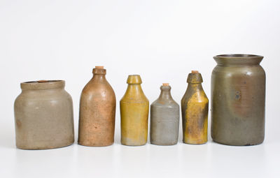 Lot of Six: Stoneware Vessels incl. Four Bottles, J. SWANK & CO. Jar, Unmarked Van Schoik & Dunn Jar