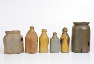 Lot of Six: Stoneware Vessels incl. Four Bottles, J. SWANK & CO. Jar, Unmarked Van Schoik & Dunn Jar
