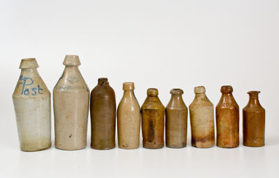 Lot of Nine: Nineteenth Century Stoneware Bottles, primarily American