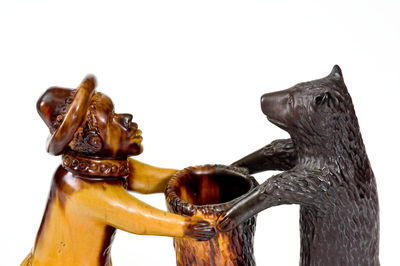 Exceedingly Rare and Important Pennsylvania Redware Preacher and Bear Figure