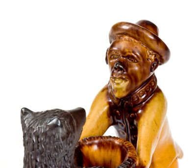 Exceedingly Rare and Important Pennsylvania Redware Preacher and Bear Figure