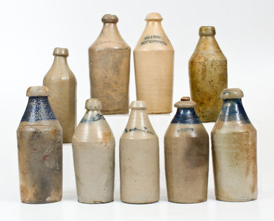 Lot of Nine: Stoneware Bottles incl. Dated and Cobalt Decorated Examples