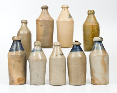 Lot of Nine: Stoneware Bottles incl. Dated and Cobalt Decorated Examples