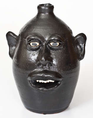 Rare Black-Glazed Stoneware Face Jug, Signed 