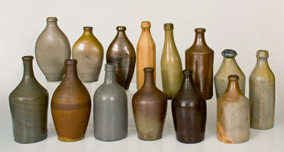 Lot of Fourteen: Stoneware Bottles and Flasks incl. Early Examples