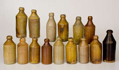 Lot of Fifteen: Stoneware Bottles with Impressed Advertising