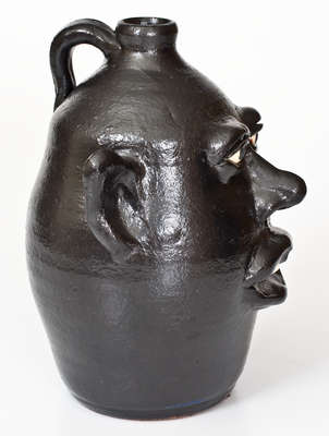 Rare Black-Glazed Stoneware Face Jug, Signed 