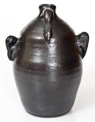 Rare Black-Glazed Stoneware Face Jug, Signed 