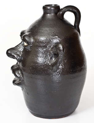 Rare Black-Glazed Stoneware Face Jug, Signed 