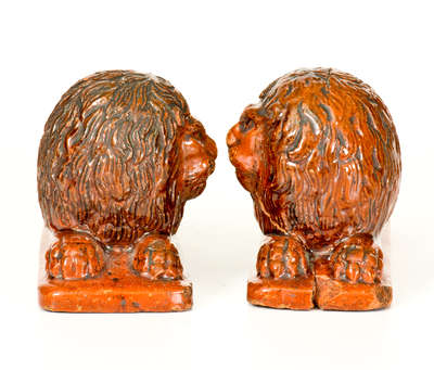 Pair of Glazed Redware Lion Figures, probably PA origin, mid 19th century